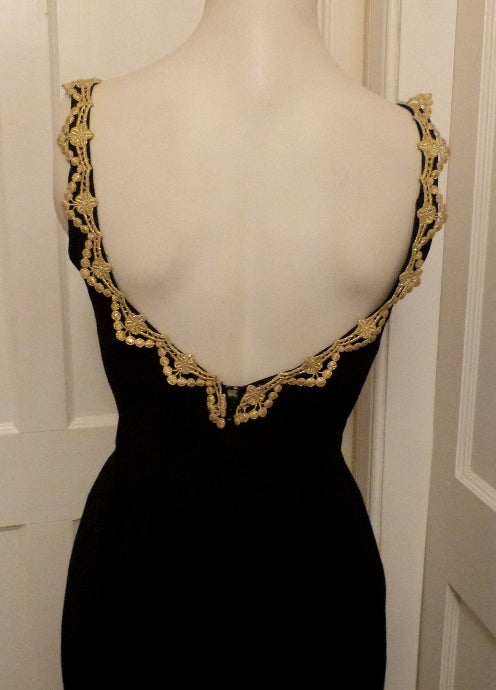 Vintage black evening dress with gold braid trim Vintage black evening dress with gold braid trim